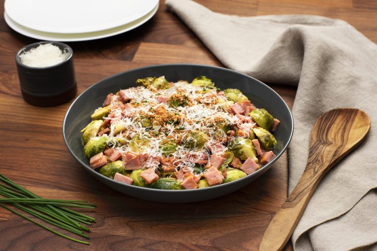 cheesy slow cooker brussel sprouts made with kentucky legend ham